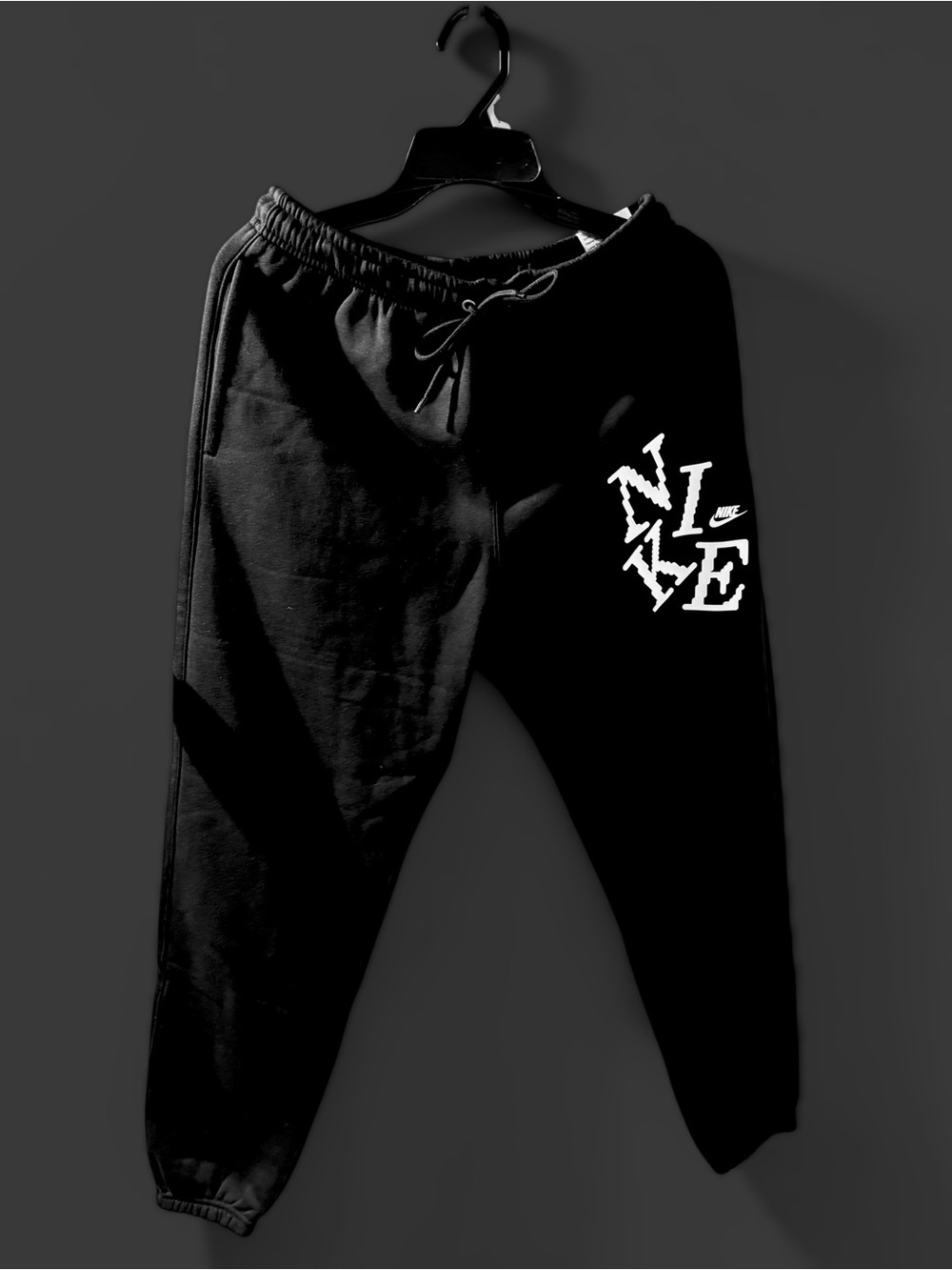 Nike Black Jogger Sweatpants with White Distressed Logo